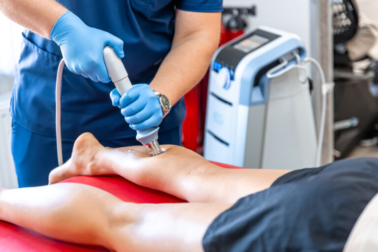 physical therapy of the shin with shock wave, extracorporeal shockwave therapy.